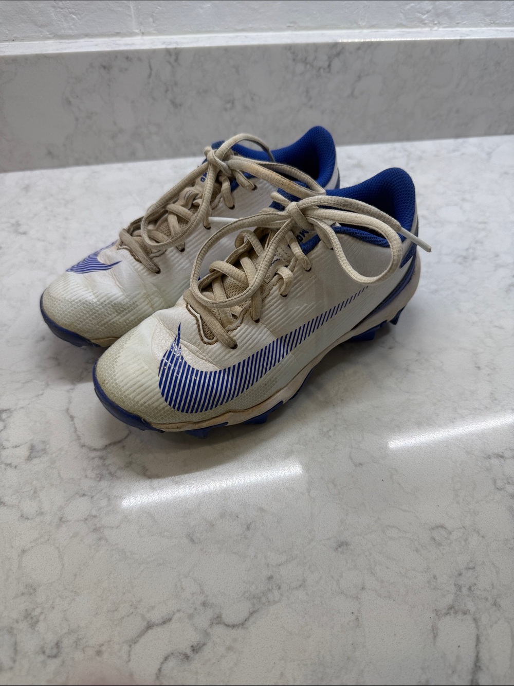 Nike Kids White and Blue Cleats, Size 2